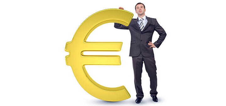 Businessman near big euro sign